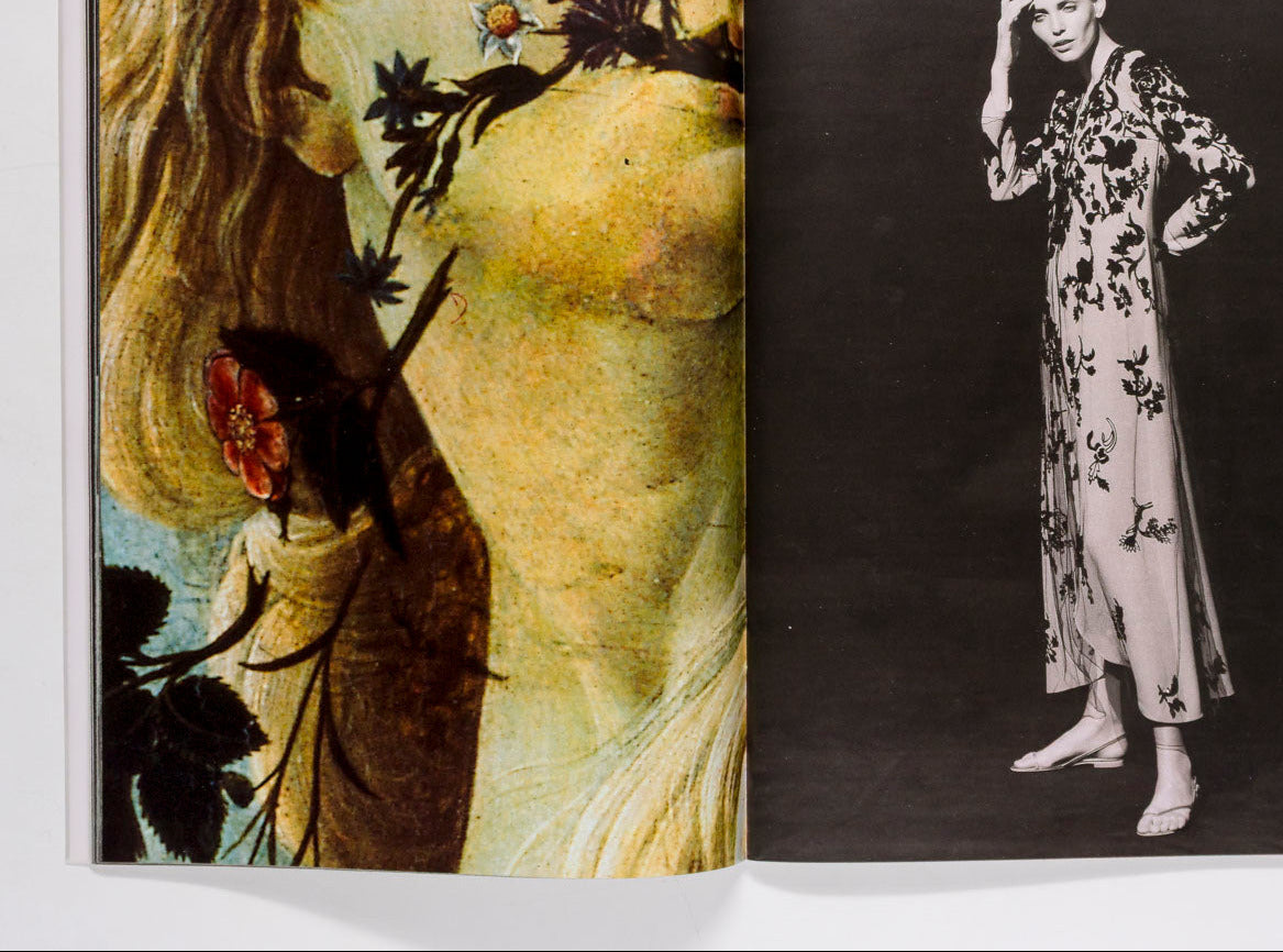 An open book or magazine spread showing two pages: the left page features a warm-toned artistic portrait with floral elements, and the right page shows a black-and-white fashion photograph of a woman wearing a long floral dress.
